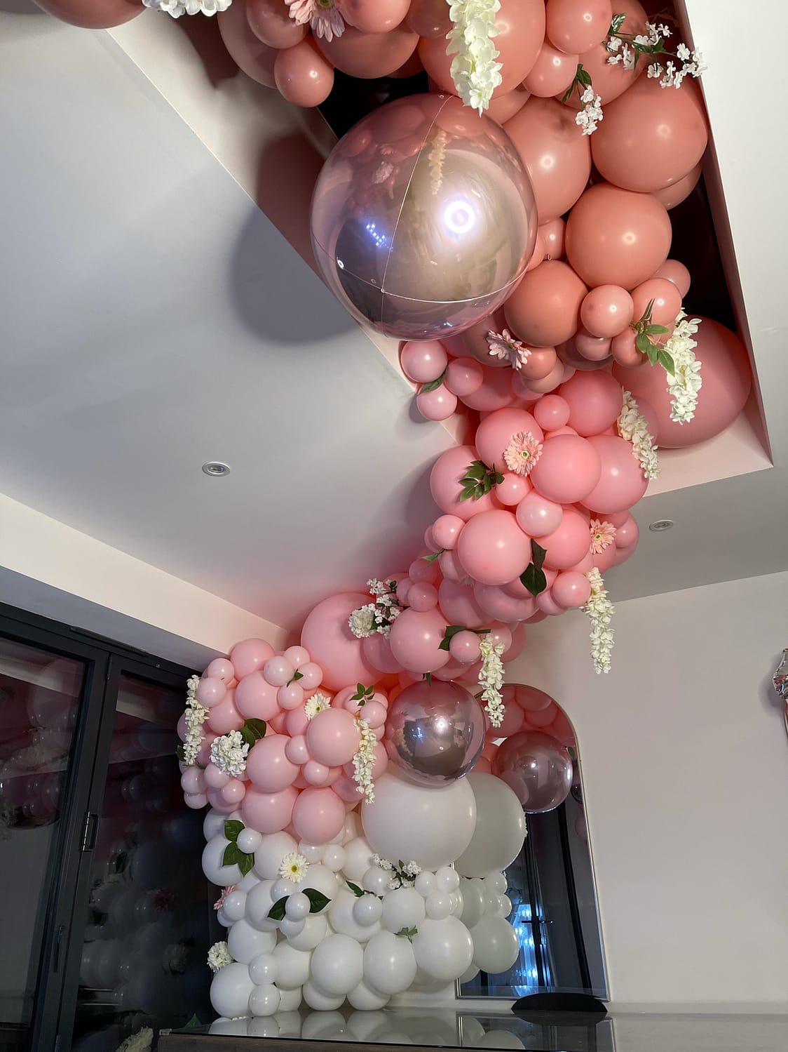 Pink, white and rose gold balloons with hanging flowers