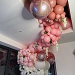 Pink, white and rose gold balloons with hanging flowers