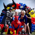 Superhero themed birthday balloons and character dress up