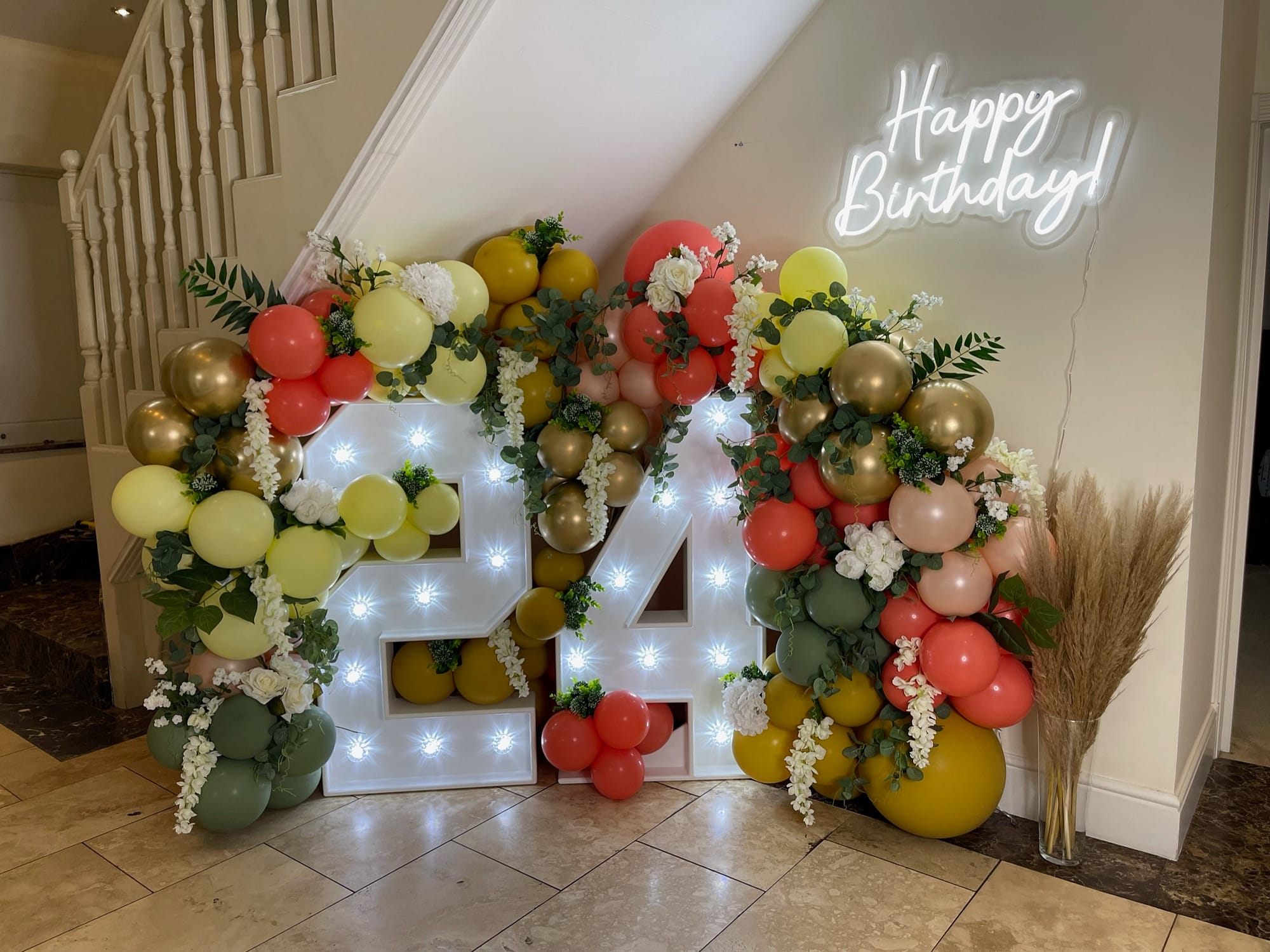 24 light up numbers with balloons, flowers and Happy Birthday neon light